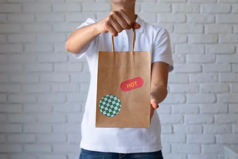 hand-holding-delivery-food-bag