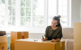 woman packing before moving back home