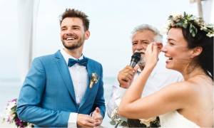 couple-next-to-elderly-man-giving-wedding-speech