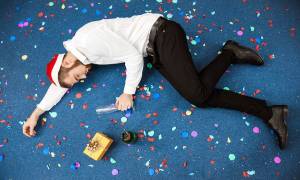 man-passed-out-office-holiday-party-mistakes