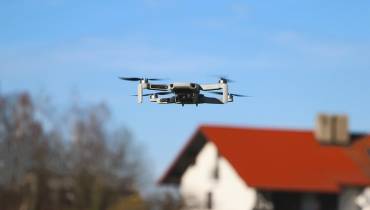 drone-flying-over-house-micro-camera-applications-in-industries