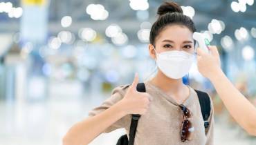 woman-wearing-covid-mask-airport-terminal