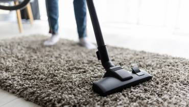 woman-cleaning-carpet-home-professional