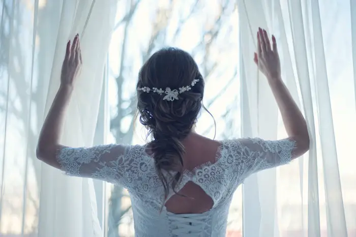 bride-spreading-white-textile