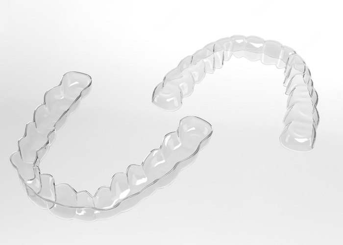 two-invisible-braces-invisalign-white-background-top-view.jpg